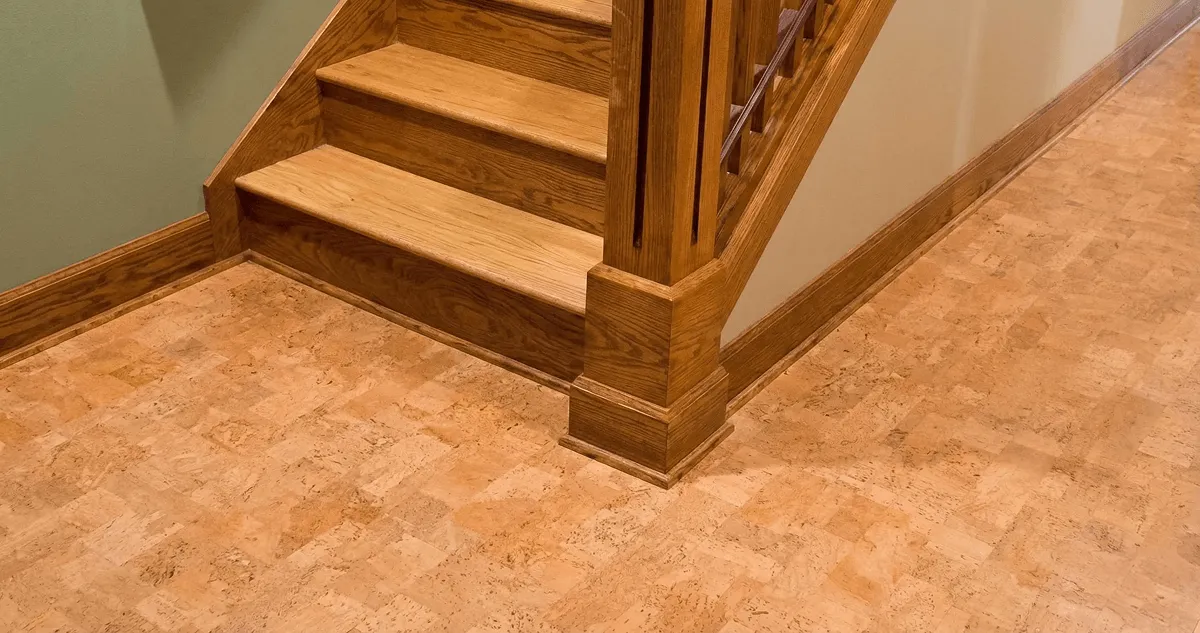 End of a staircase with cork flooring in Albany, NY