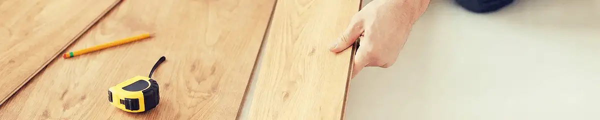 A professional installing wood flooring in Albany, NY