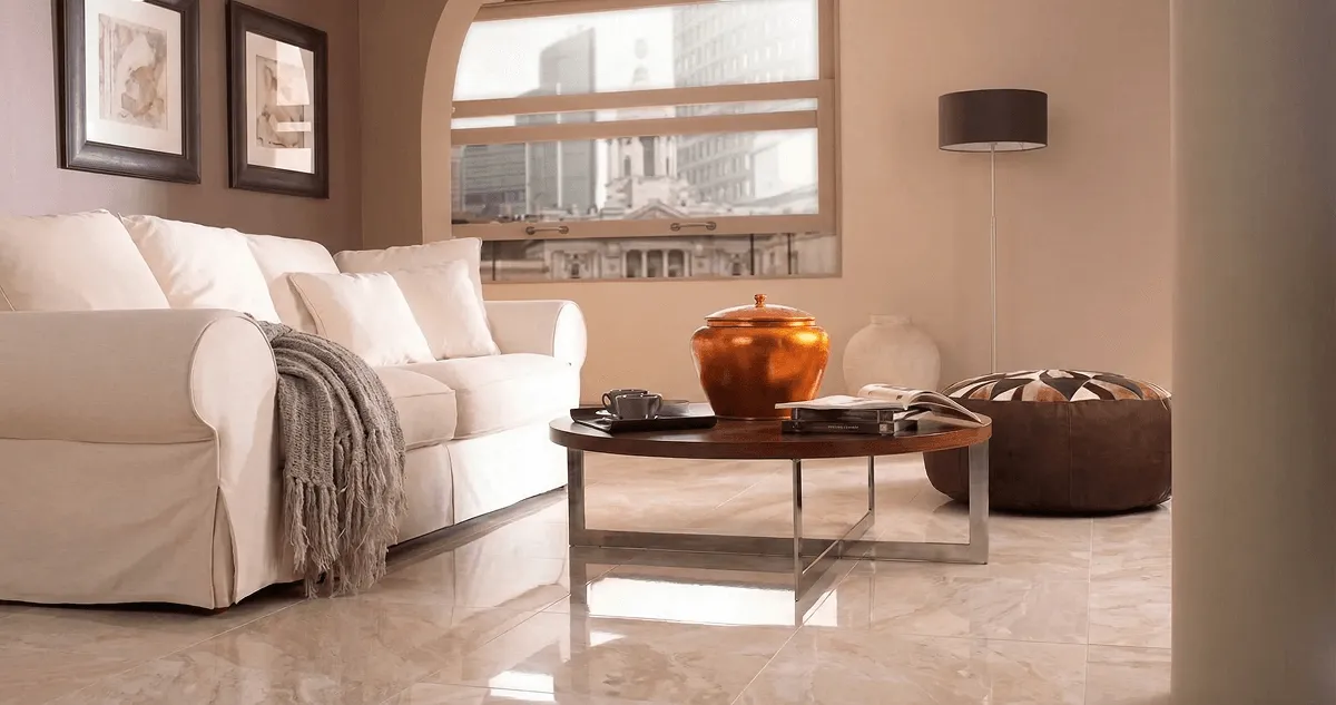 Modern living room with professionally installed marble flooring, a beige sofa, coffee table in Albany, NY
