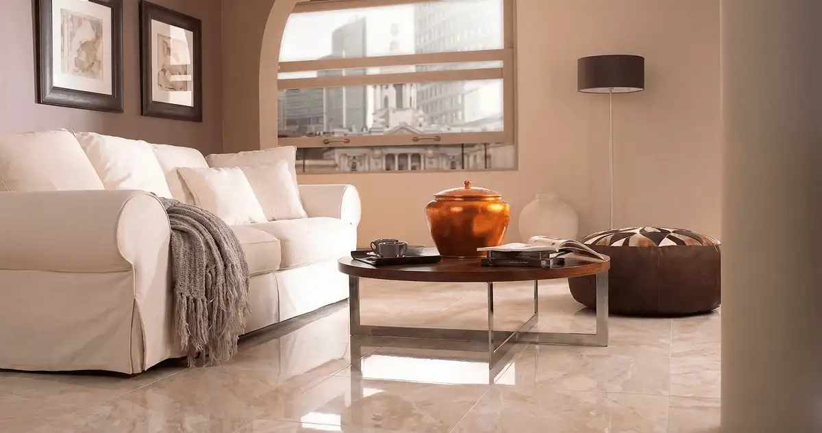 Modern living room with professionally installed marble flooring, a beige sofa, coffee table in Albany, NY