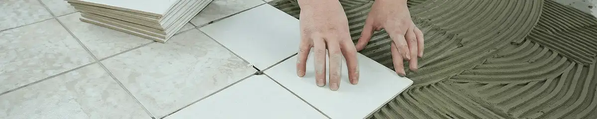 Professional installing white tile floors in Albany, NY