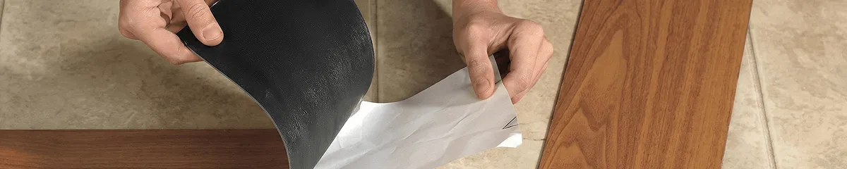 A professional installing vinyl flooring in Albany, NY