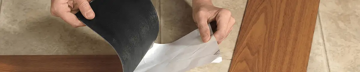 A professional installing vinyl flooring in Albany, NY