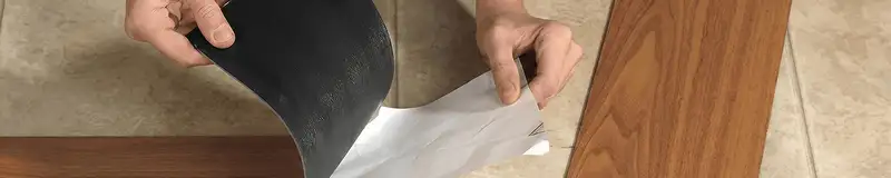 A professional installing vinyl flooring in Albany, NY
