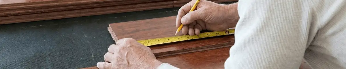 A professional installing wood flooring in Albany, NY